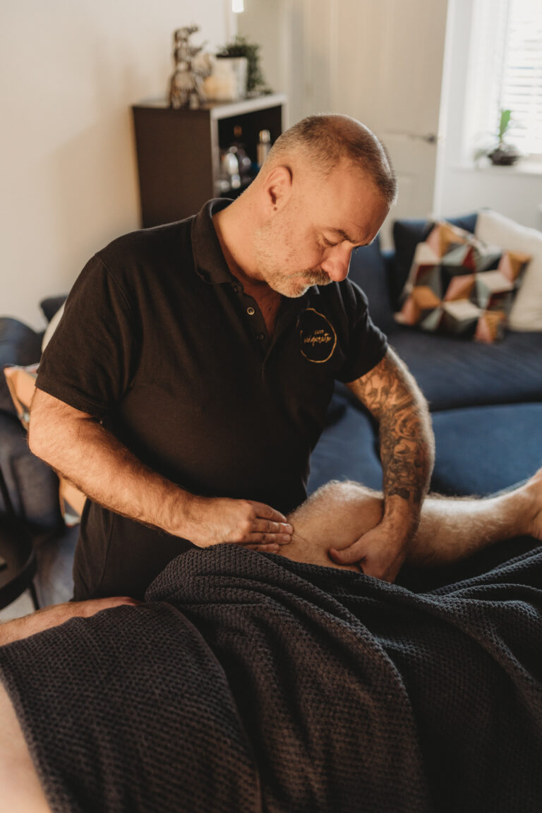 Justin massaging around the knee