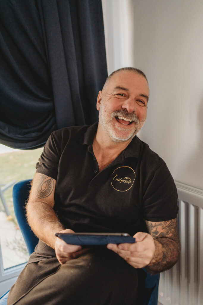 Justin laughing with iPad